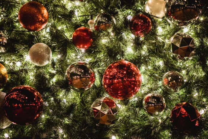 red and yellow bauble ball on the christmas tree