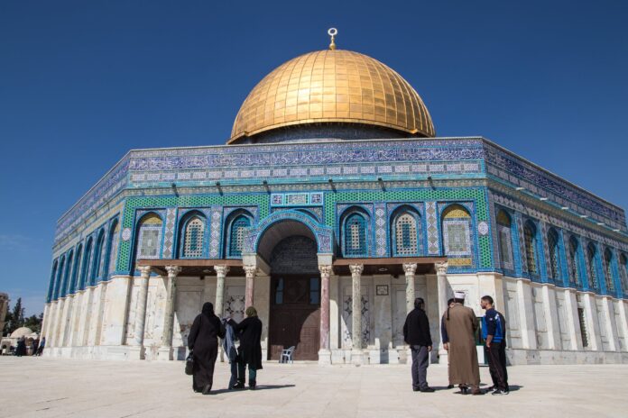 People standing in front of temple